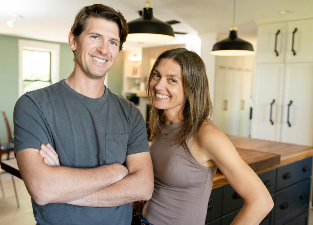 Nic and Brianna smiling in their kitchen